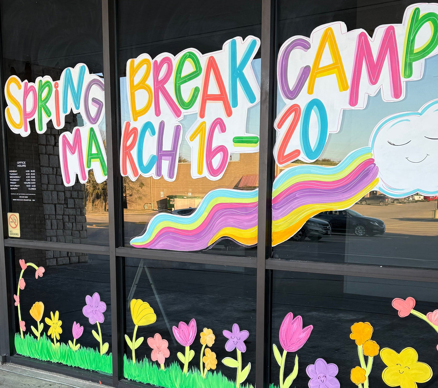 Business window display painted with colorful text and graphics for advertising